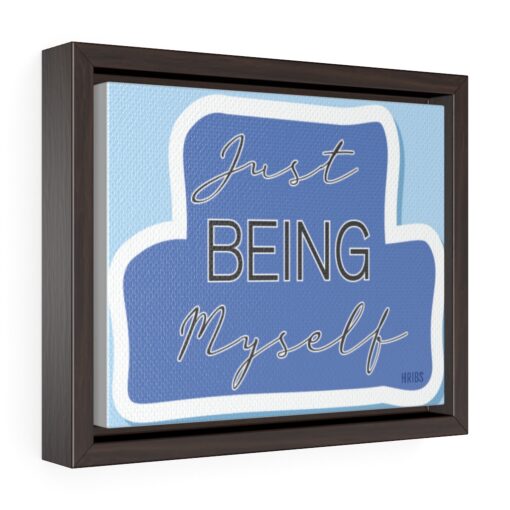 A framed print of the words just being myself