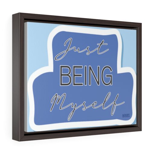 A framed print of the words just being myself