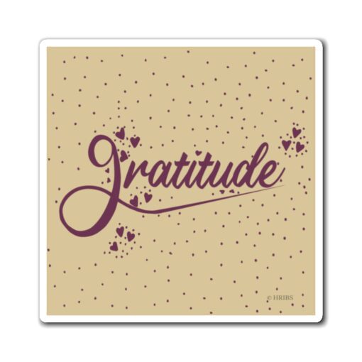 A coaster that says gratitude on it.