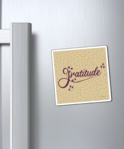 A refrigerator magnet with the word gratitude on it.