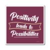 A red and white sticker with the words " positivity leads to possibilities ".