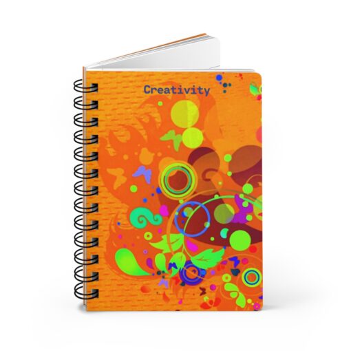 A spiral notebook with an orange cover and colorful designs.