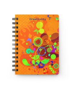 A spiral notebook with an orange cover and colorful designs.