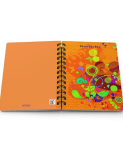 A spiral bound notebook with an orange cover.