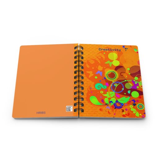 A spiral bound notebook with an orange cover.