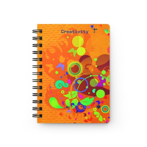 A spiral notebook with an orange cover and colorful designs.