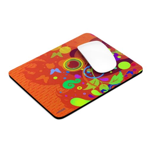 A mouse pad with an orange background and colorful designs.