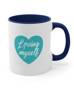 A blue and white coffee mug with the words " loving myself ".