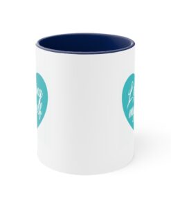 A blue and white coffee mug with the words " love is all around me ".