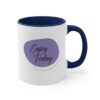 A blue and white coffee mug with the words " enjoy today ".