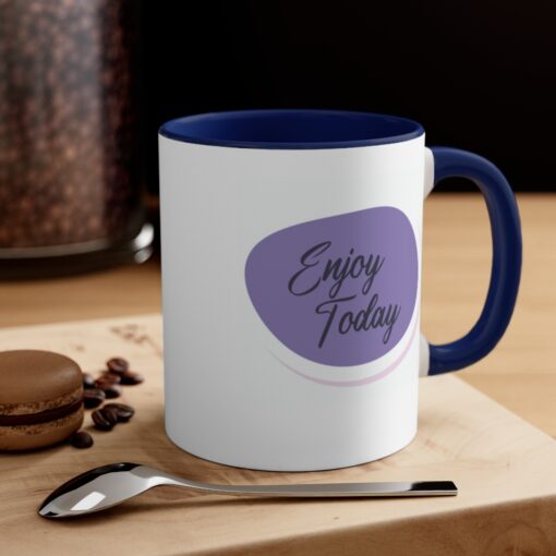 A coffee mug with the words " enjoy today ".