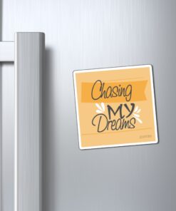 A refrigerator magnet with the words " chasing my dreams ".