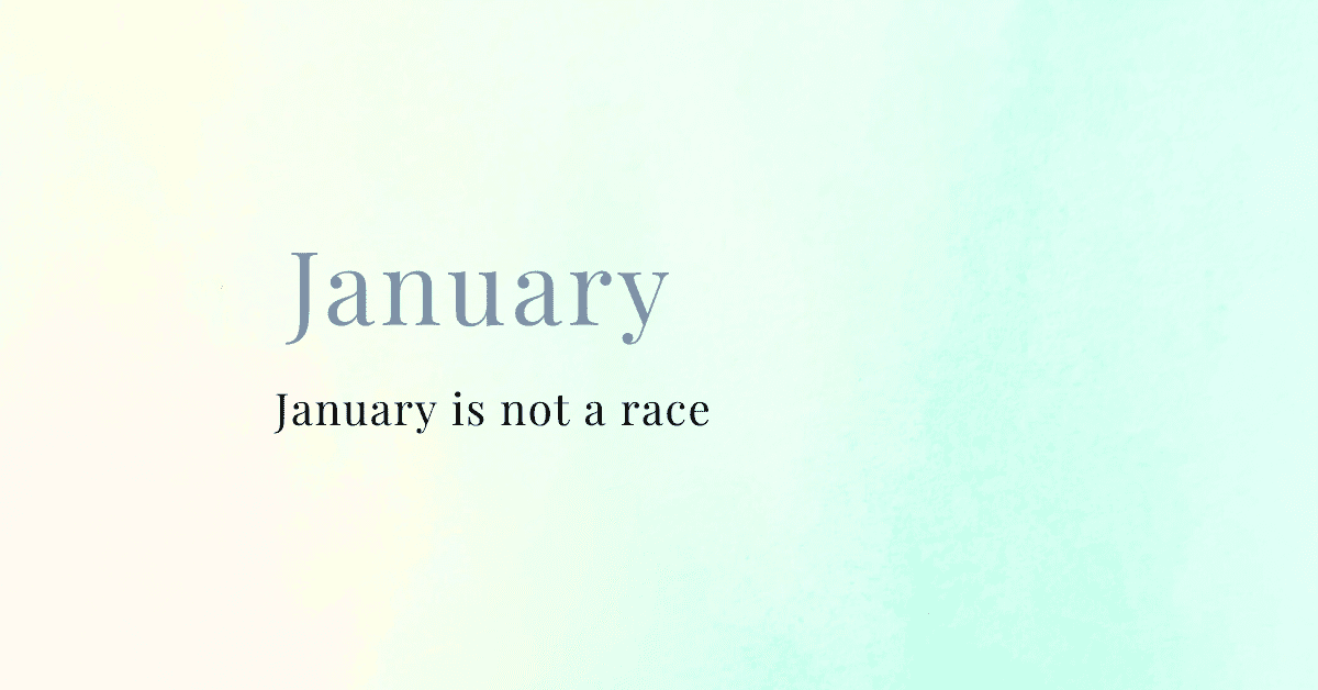 Soft watercolor gradient background in muted blue and warm tones with the word “January” and the subtitle “January is not a race,” creating a calm, reflective blog header.